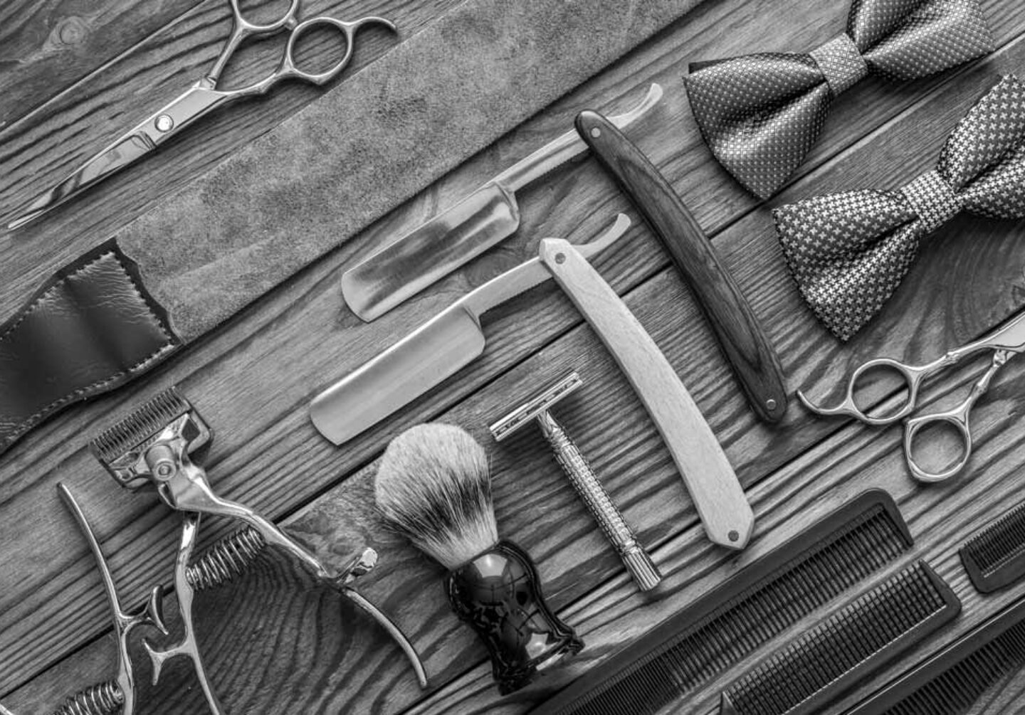 vintage-barber-shop-tools-on-wooden-background-PZJCPNV