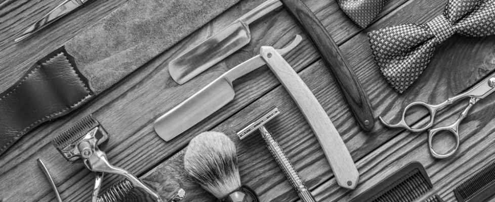 vintage-barber-shop-tools-on-wooden-background-PZJCPNV